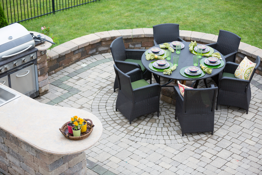 Artificial grass and hardscaping provide elegant living space outdoors.
