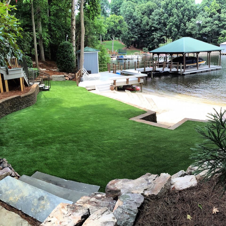 Synthetic grass backyard on a lake