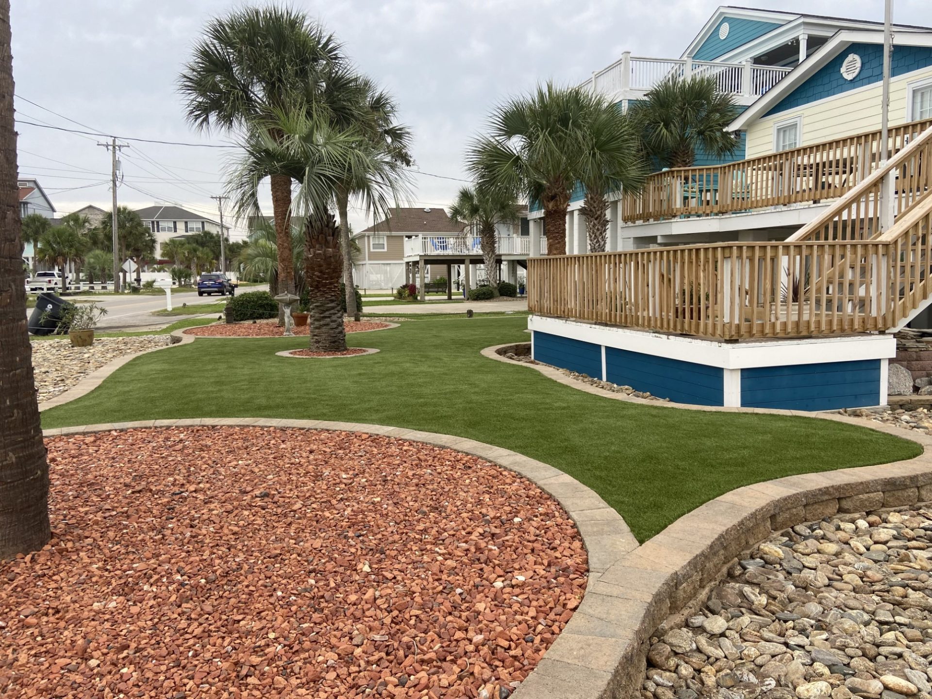 Shot of artificial grass front lawn with blue house